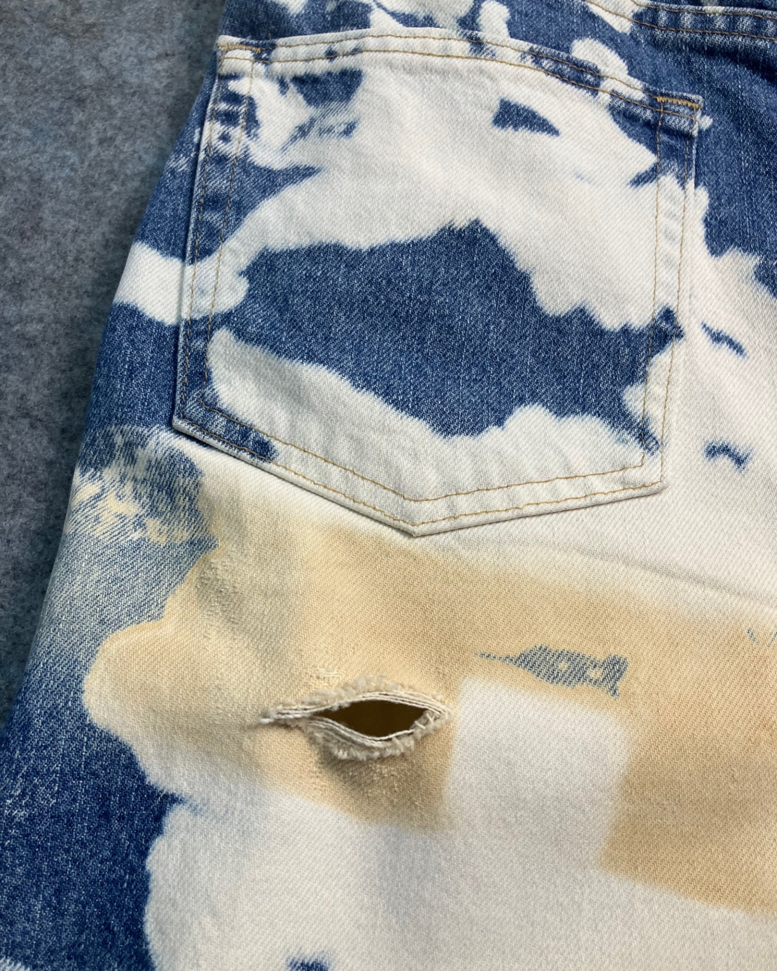 blue reworked paint-stain regular-fit jeans