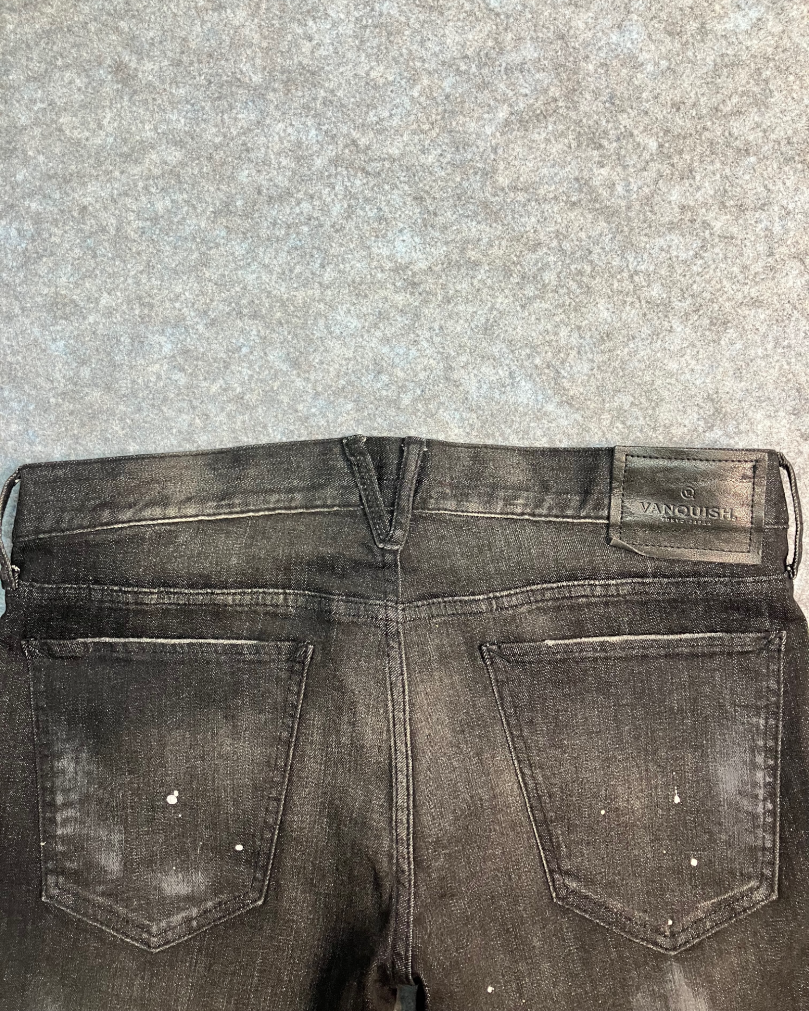 black distressed slim-fit jeans