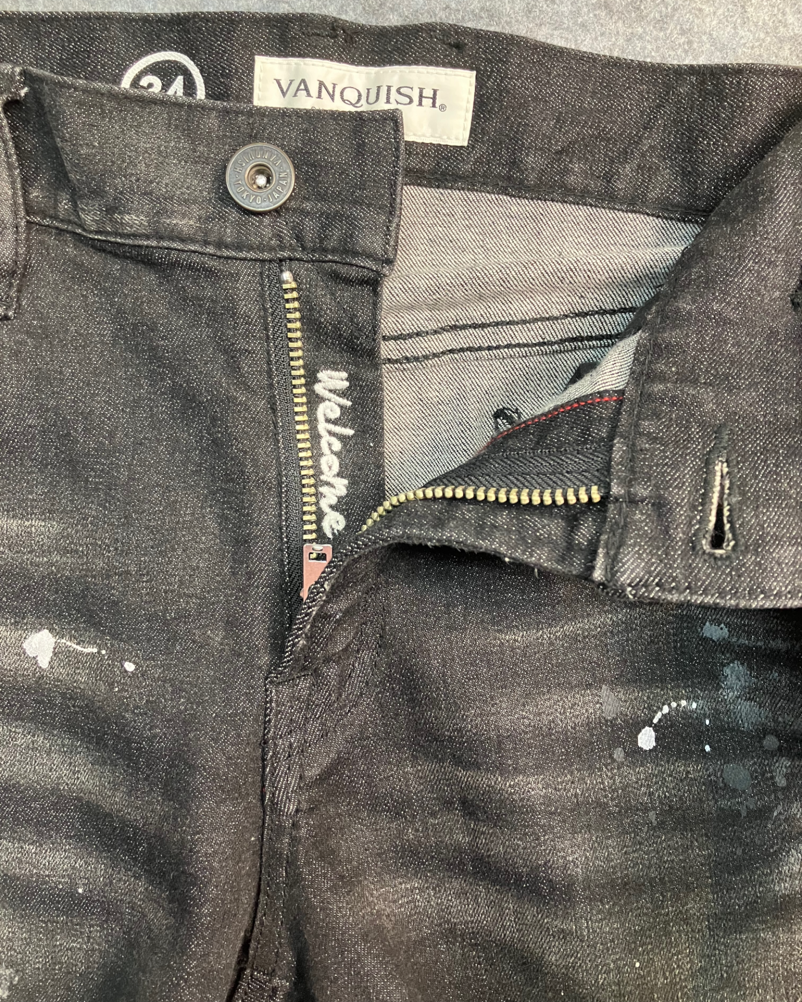 black distressed slim-fit jeans