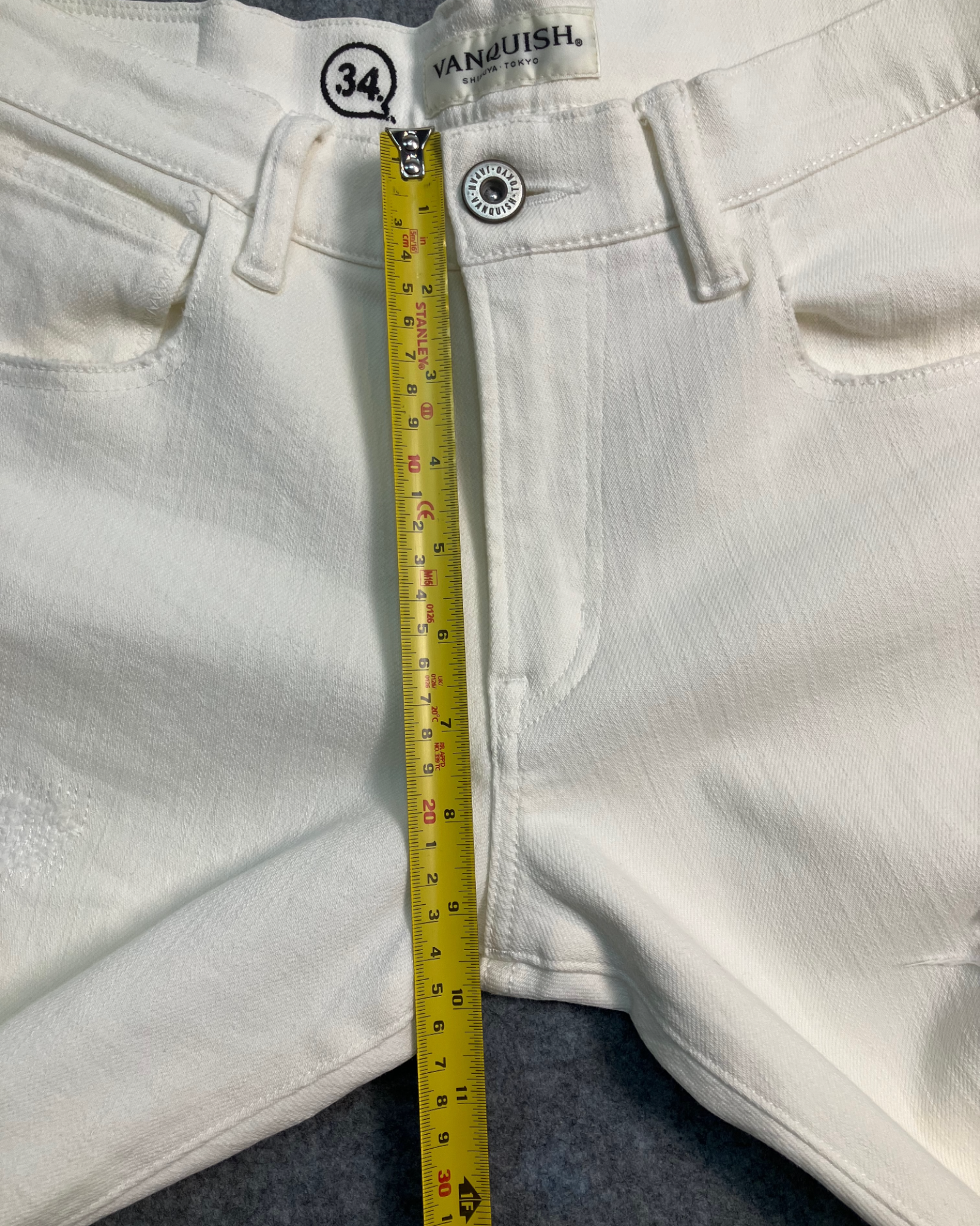 white distressed slim-fit jeans