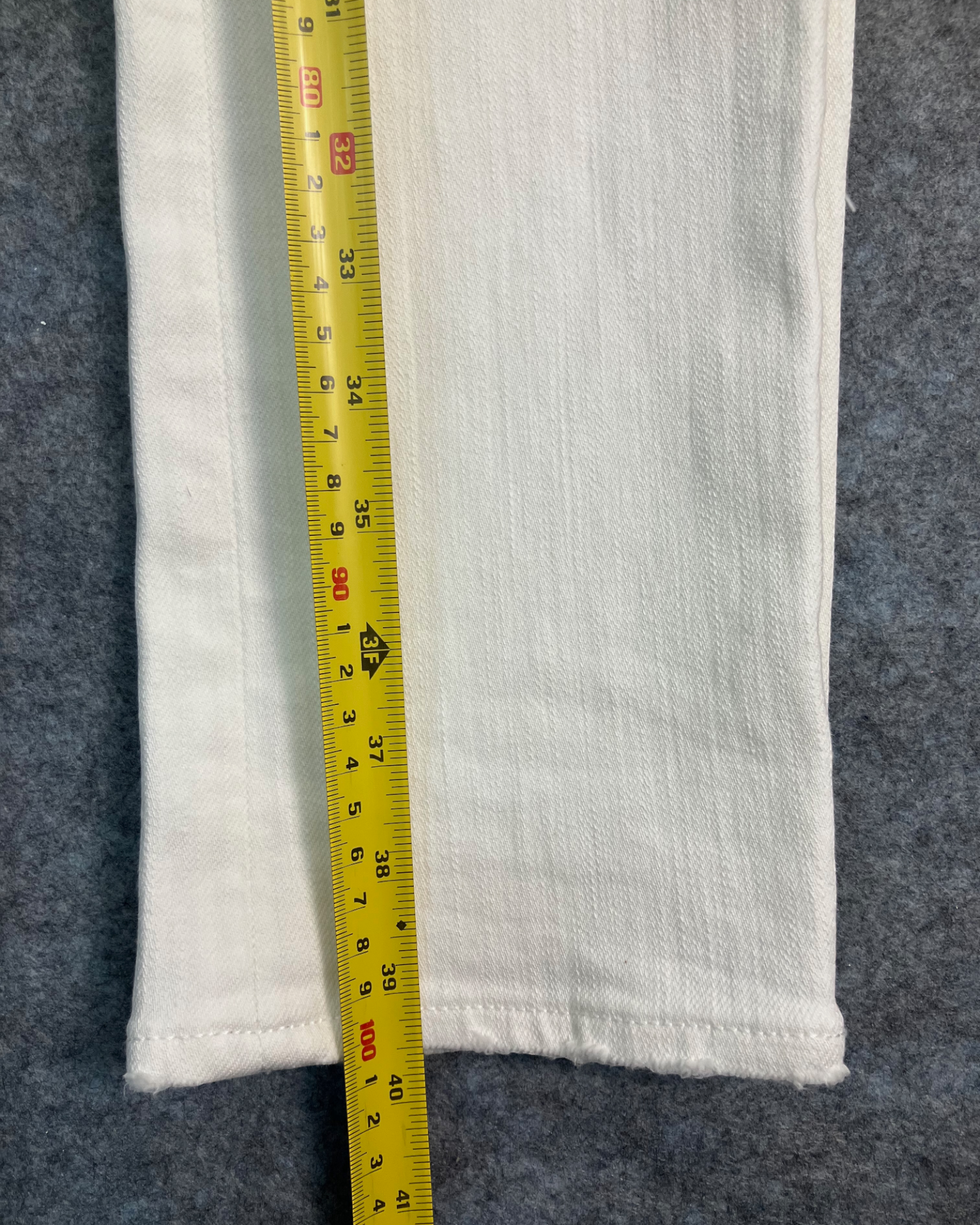 white distressed slim-fit jeans